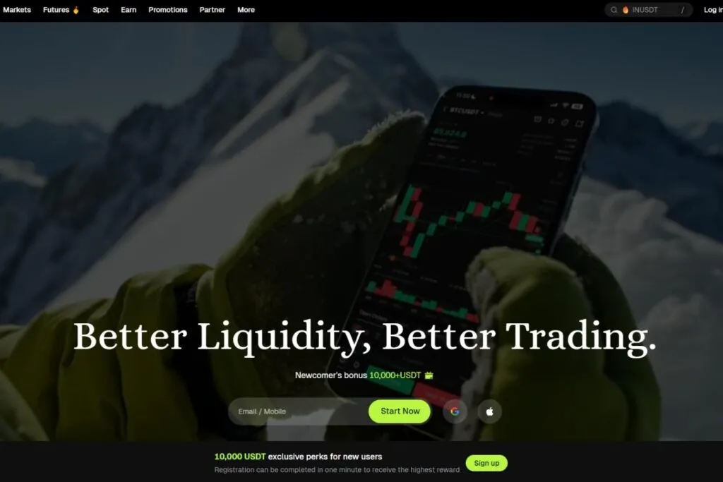 Bitunix Review: A gloved hand holding a smartphone displaying a crypto trading chart with mountains in the background.